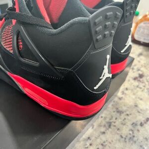 Size 14 men’s Jordan’s Retro 4 in perfect condition!